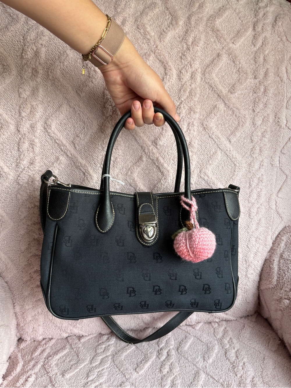 Dooney & Bourke
Navy Blue Satchel Handbag with Pink Pom Charm